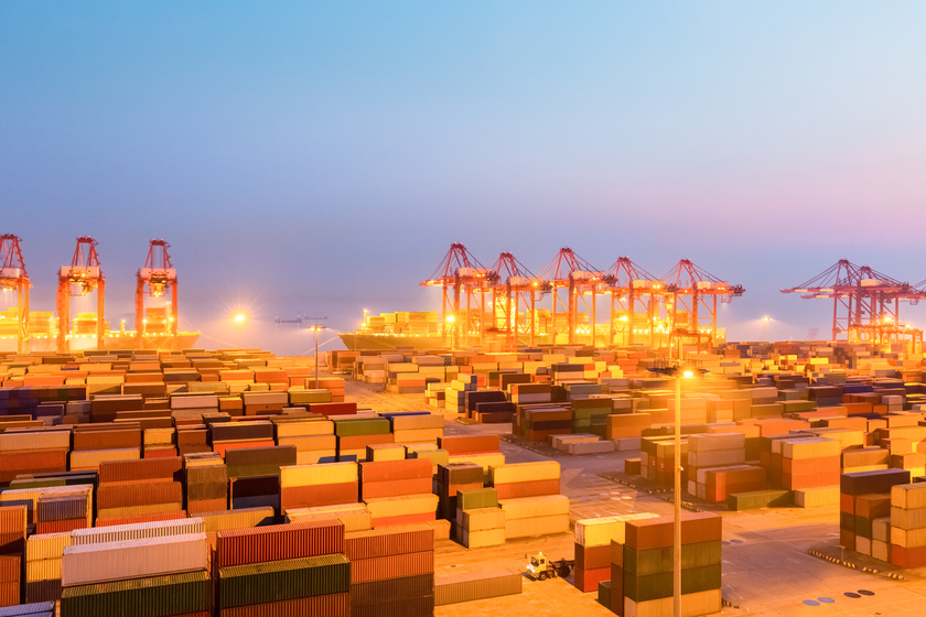 Container port at night with illuminated cranes